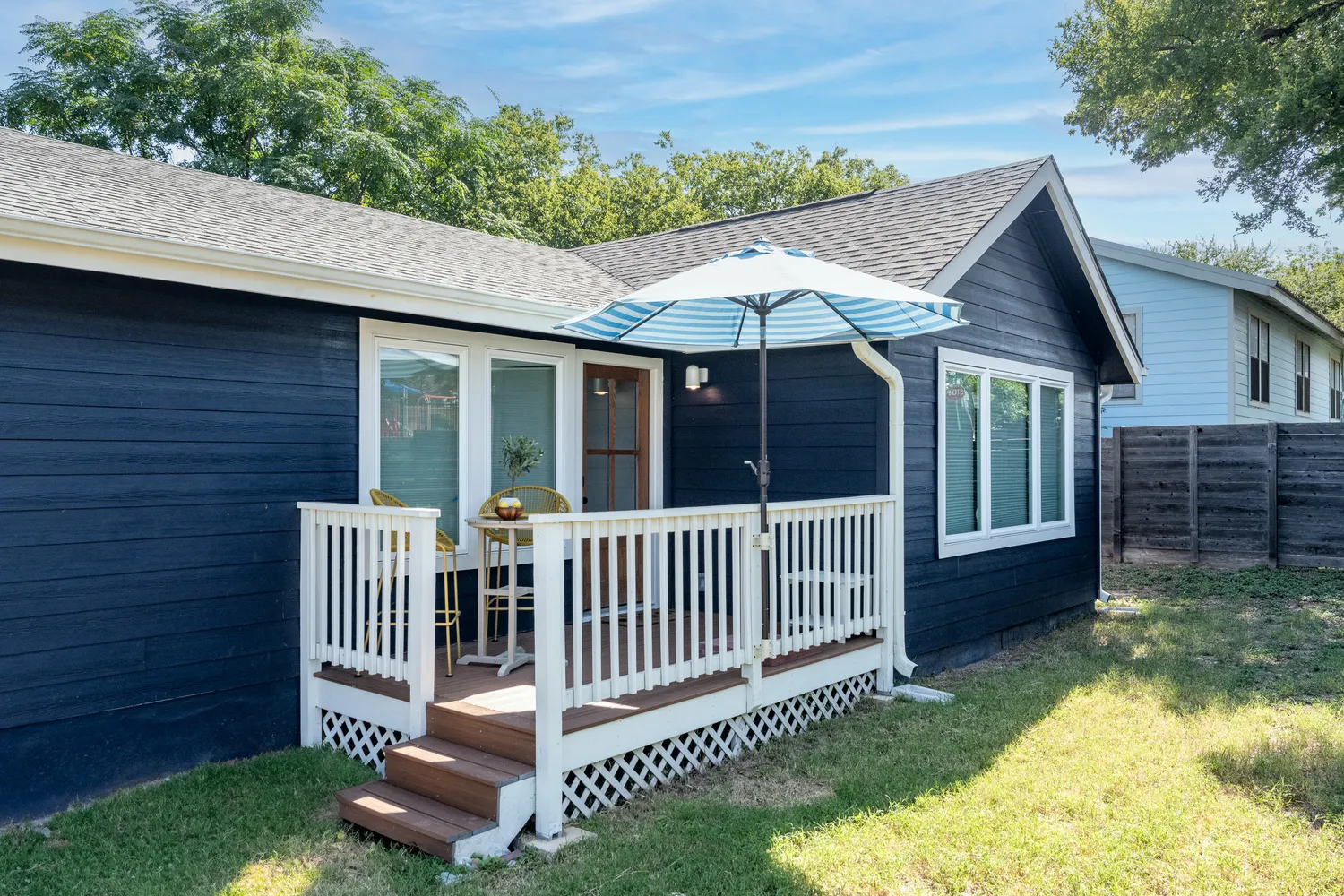 Dark Blue House With White Porch Railing