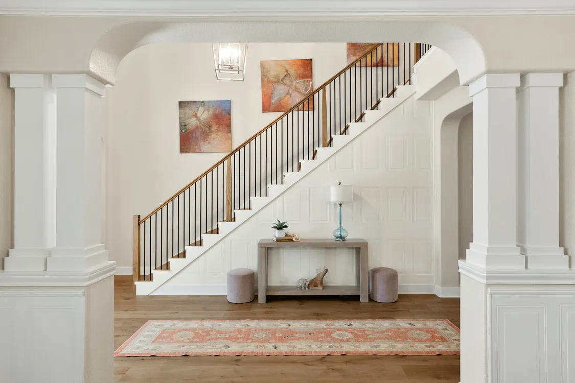 Bright and Elegant Entryway with a Wooden Staircase
