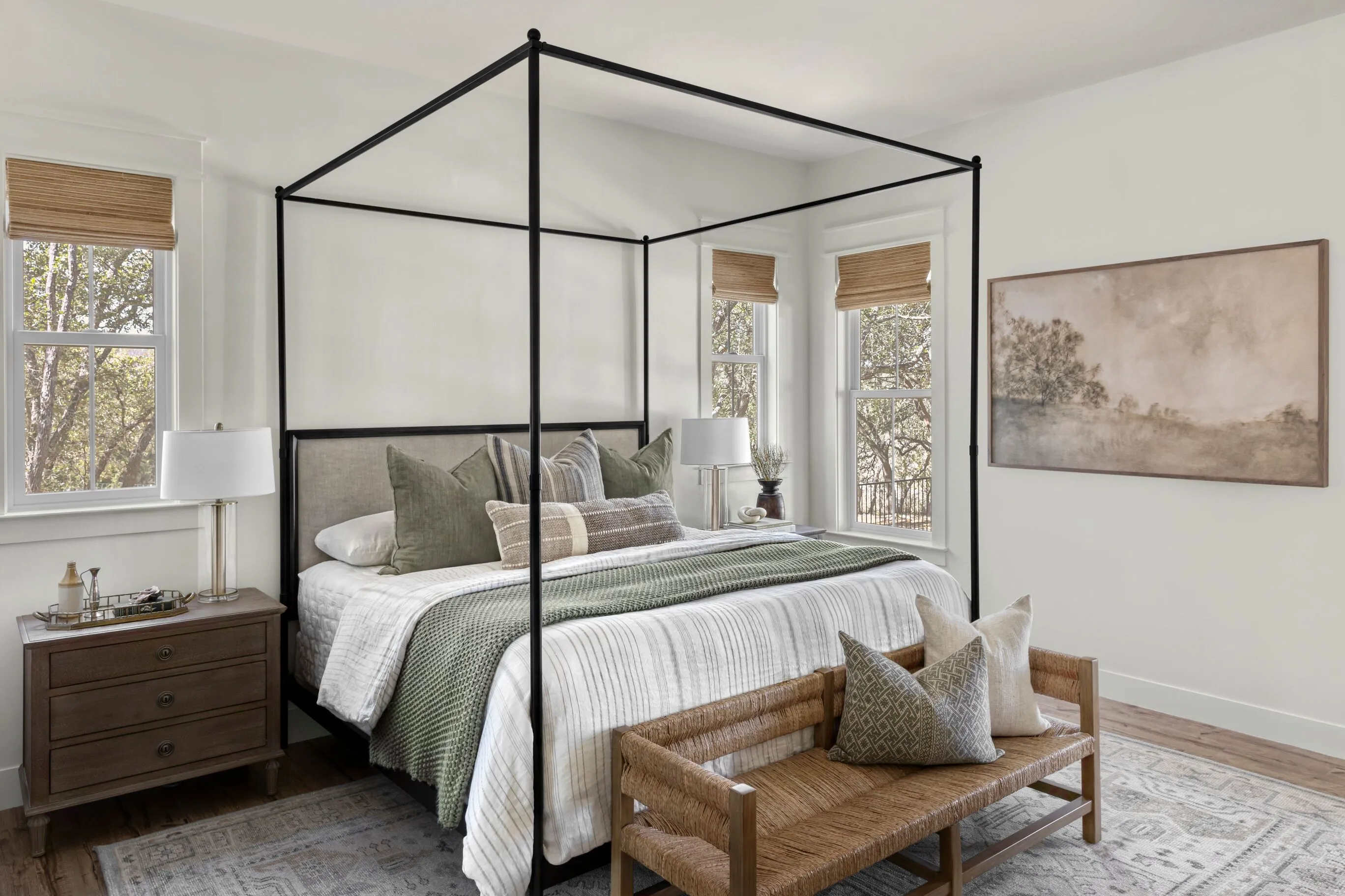 Bright And Airy Bedroom With Black Four-Poster Bed