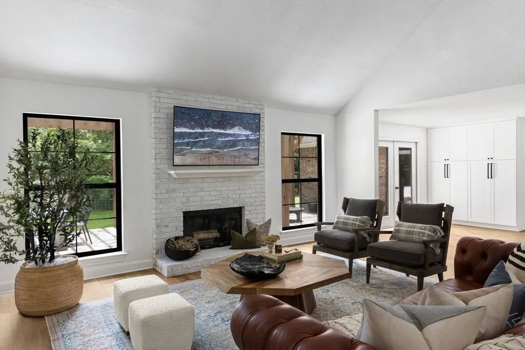 Modern Living Room with White Brick Fireplace and Wall-Mounted TV