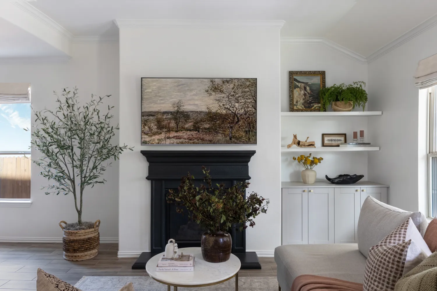 Modern Living Room Featuring a Dark Fireplace