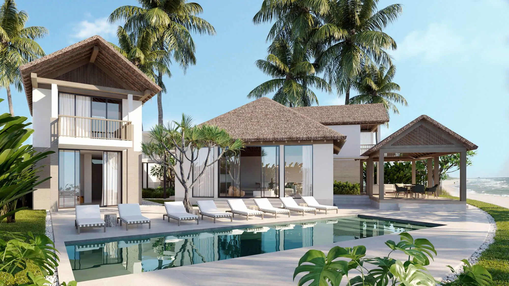 Tropical villa with pool, white lounge chairs, palm trees, and beach view