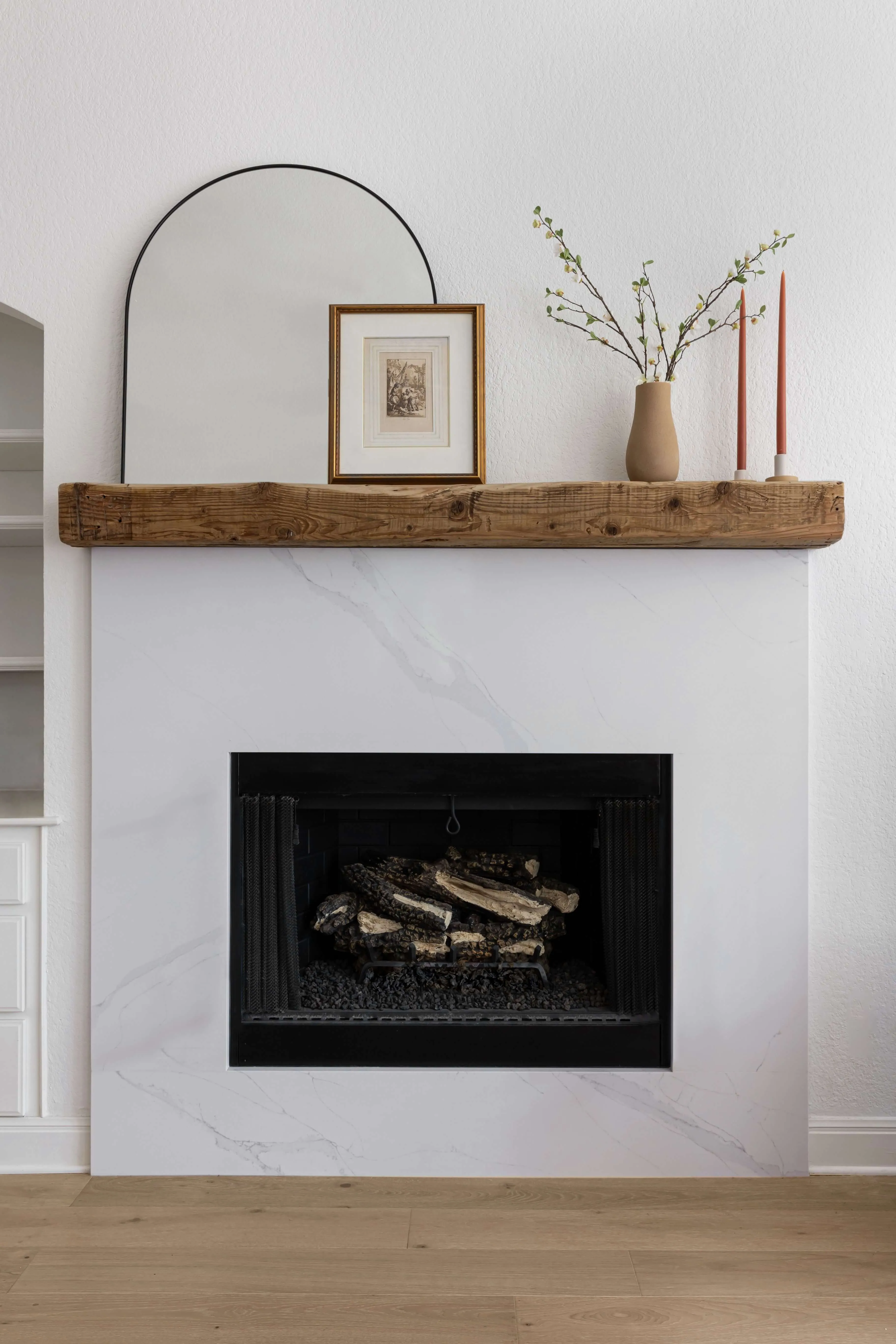 fireplace with wooden mantle and modern styling