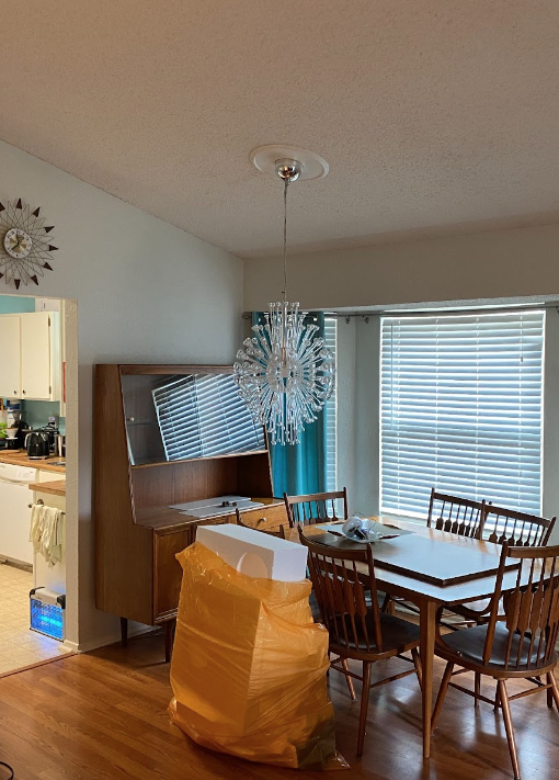 Dining room with wood floors and a wood table