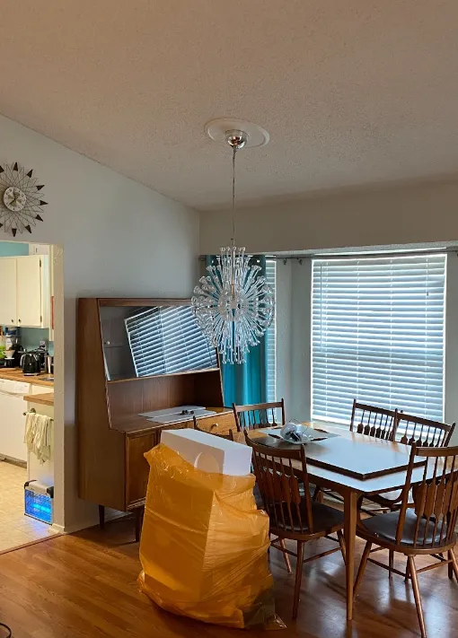 Dining room with wood floors and a wood table