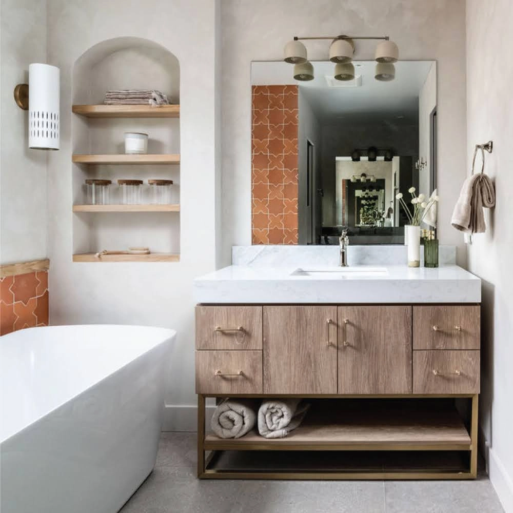 Bathroom remodeling in Austin with a freestanding tub and wood vanity.