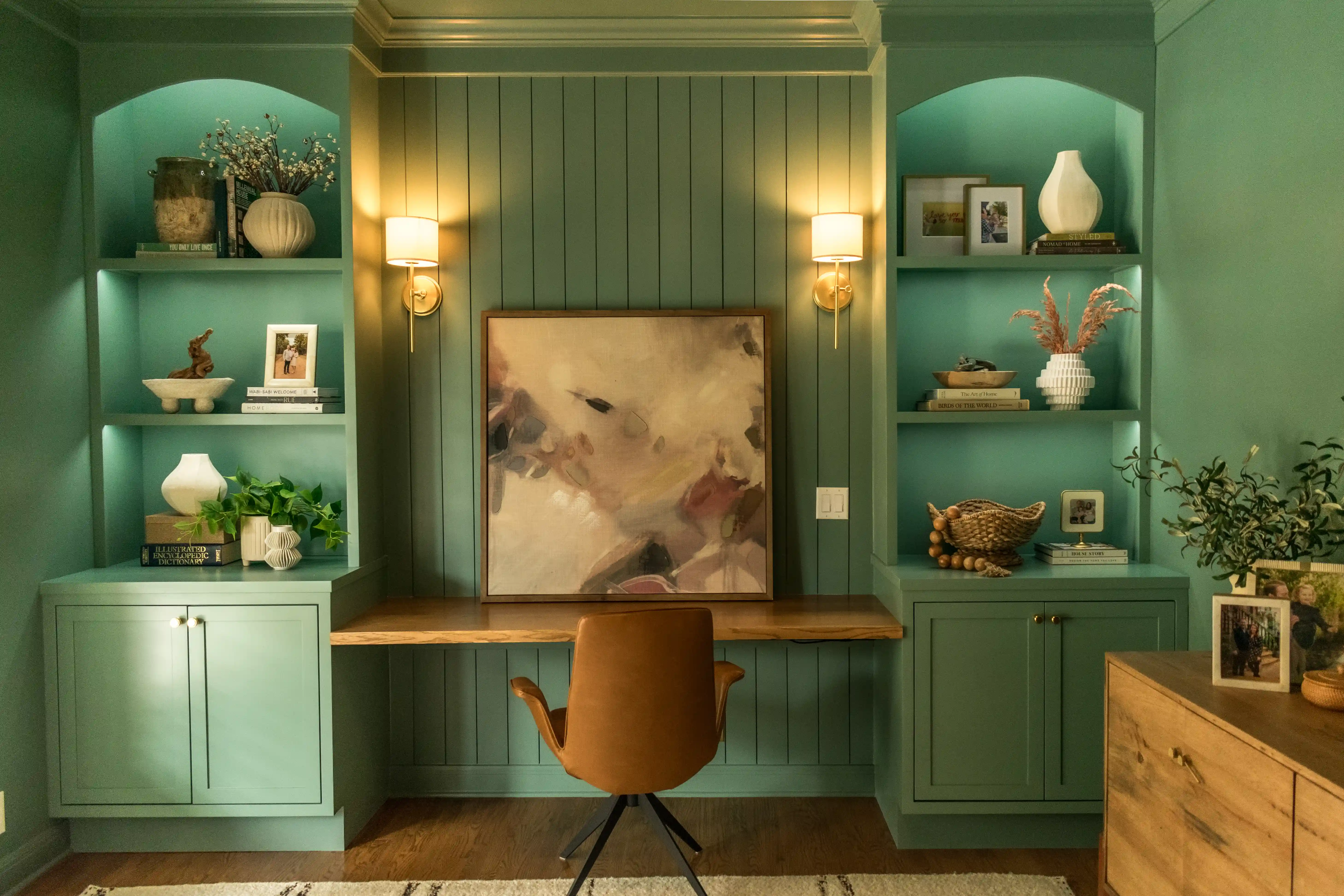 Teal home office with built-in shelves from a full home remodeling in Austin.