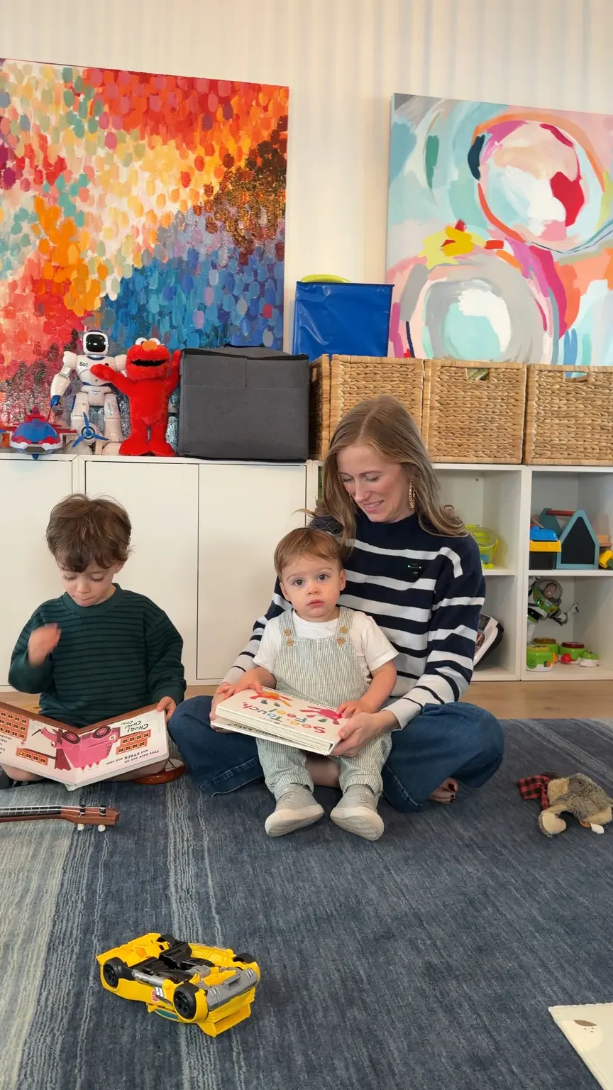Family reading in a playroom from a full home remodeling in austin.