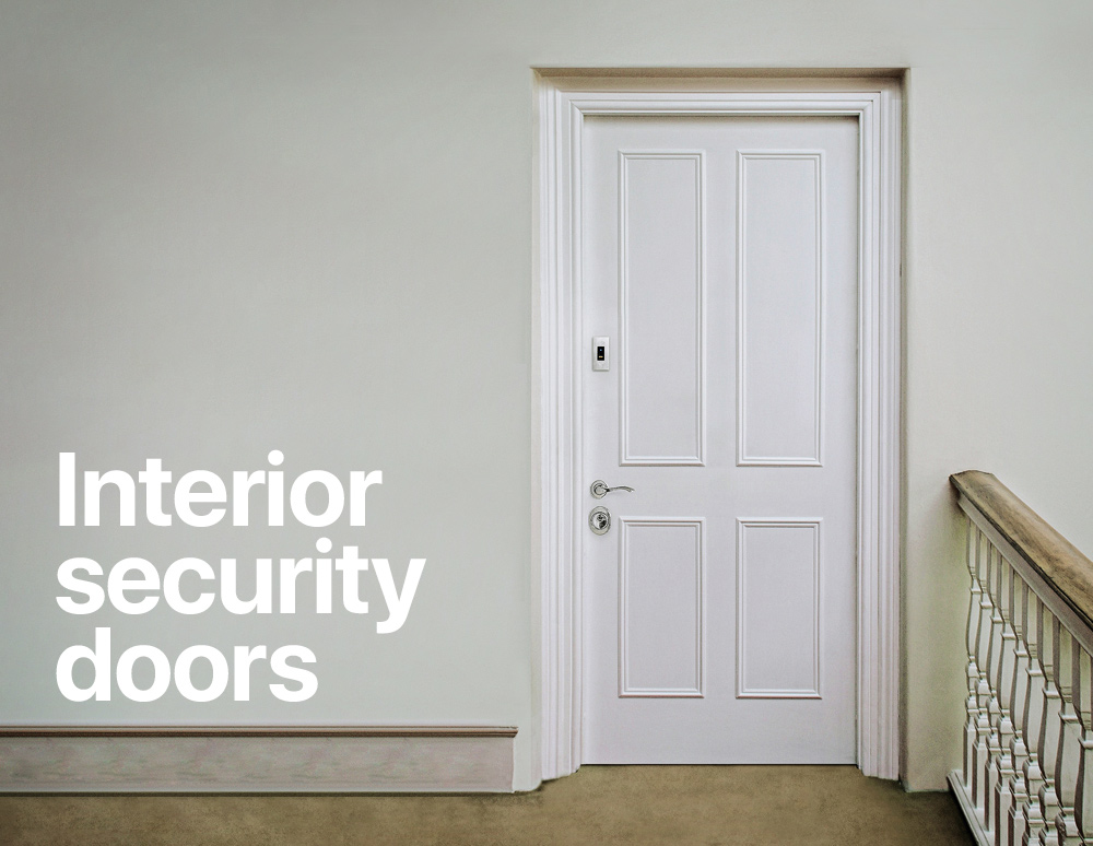 White interior security door installed beside a staircase, with the text “Interior security doors.”