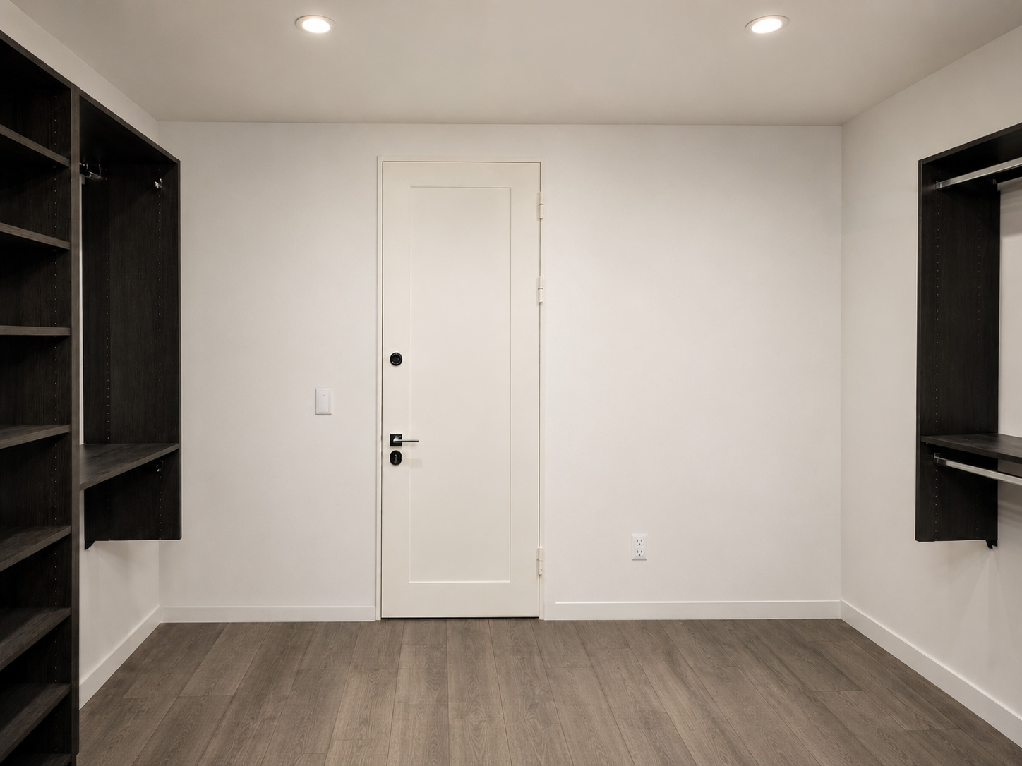 Finished closet safe room with Armored Doors ballistic fiberglass panels concealed behind the wall around a white security door