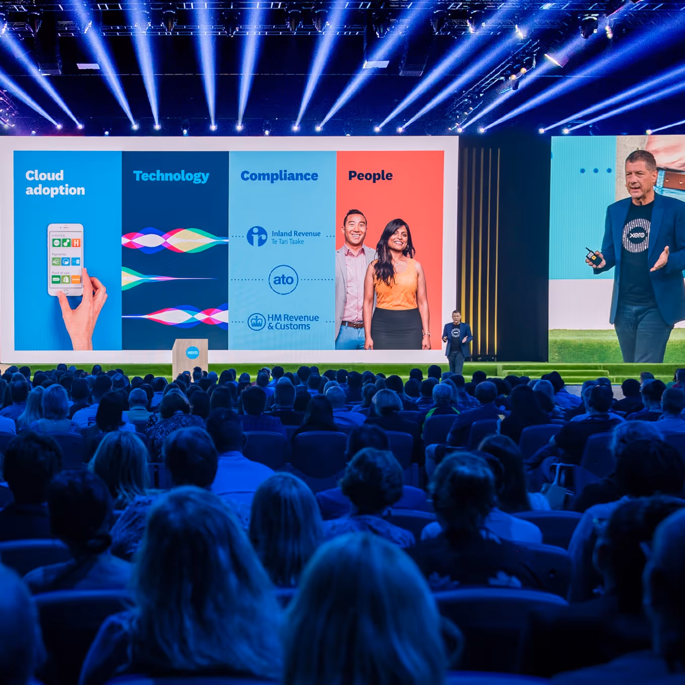 A photo depicting a Xero presenter on stage at Xerocon