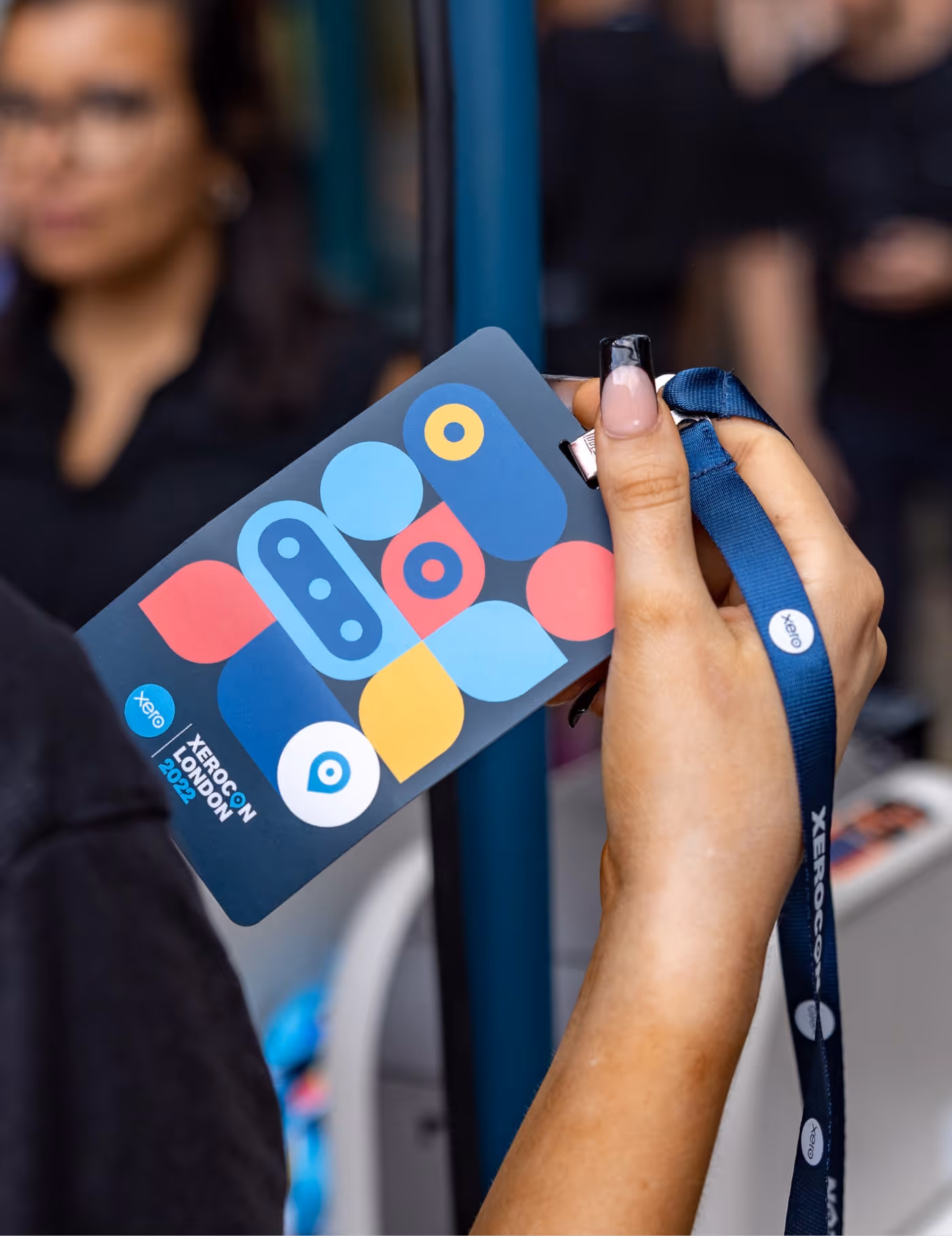 A photo showing someone holding a Xerocon lanyard