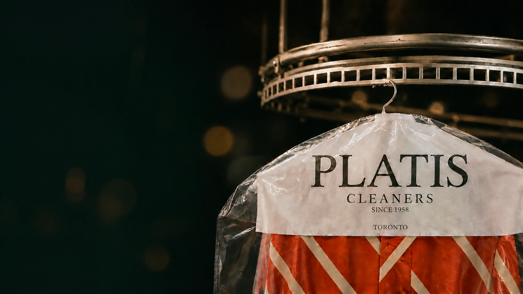 Platis Cleaners garment displayed on an overhead dry-cleaning conveyor