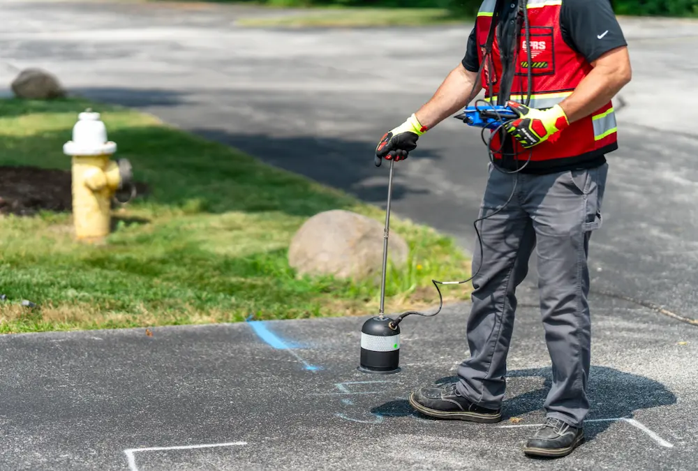 A GPRS Leak Detection Project Manager Utilizes an Elephant Foot listening device and a leak correlator to pinpoint leaks