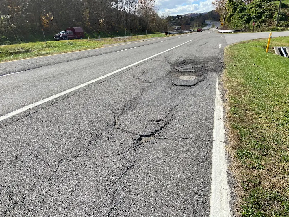 Asphalt damage on a two lane highway