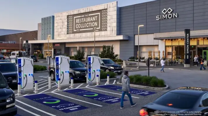 A visualization image created by BP showing what Gigahub EV chargers would look like outside a mixed-use retail and dining complex. 