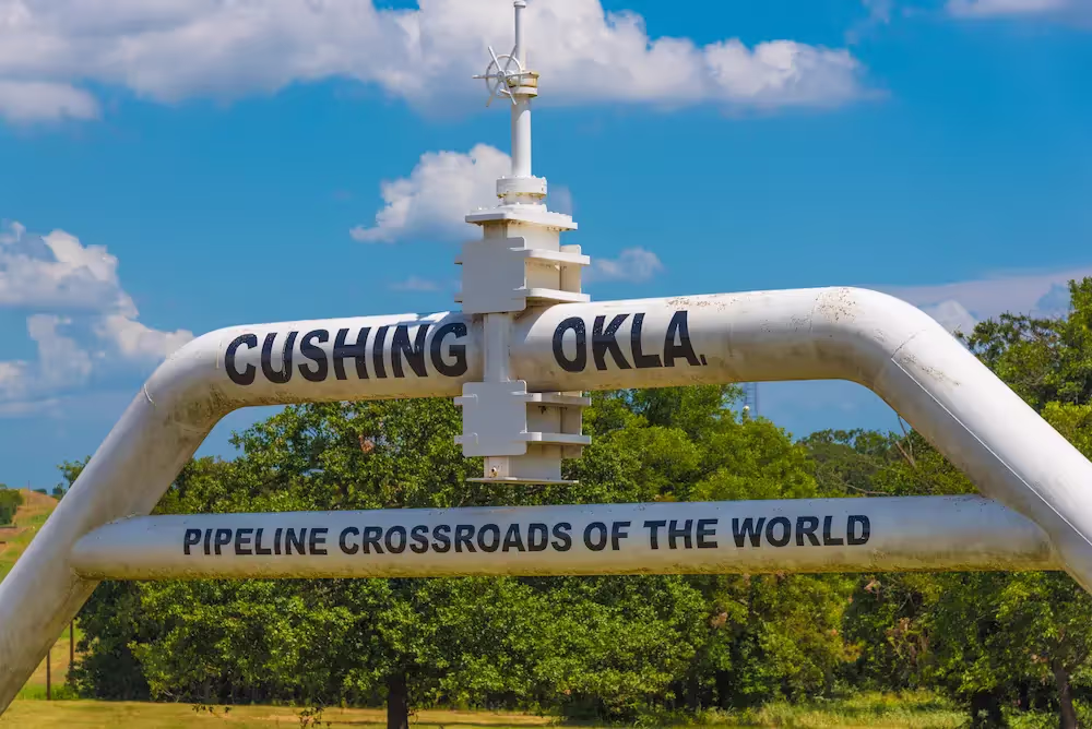 An gas & oil aboveground transmission line labeled the Pipeline Crossroads of the World in Cushing, Oklahoma.