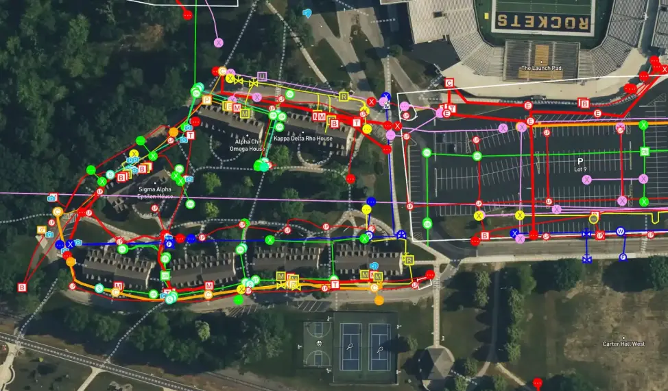 A brightly colored digital subsurface utility map of a portion of a college campus, delivered in SiteMap.