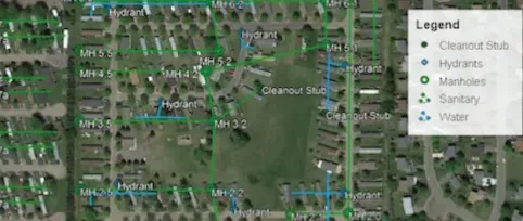 Satellite imagery with green and blue lines representing sewer and water lines.