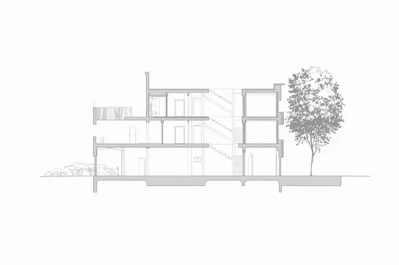 Architectural section of a modern multi-story building with visible interior and staircase design elements.