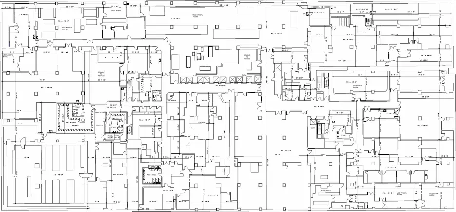 A detailed architectural floor plan of a large building, showing various rooms, corridors, staircases, and other structural elements.