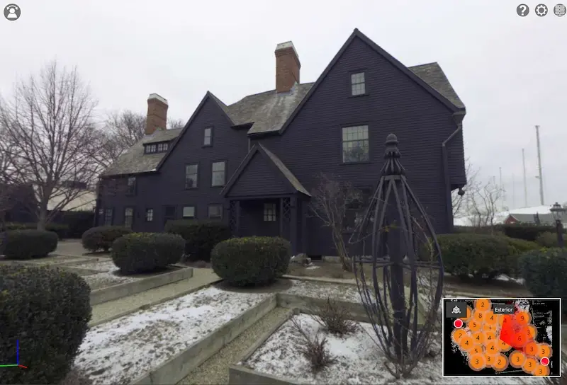 The House of the Seven Gables with a garden and a fence.