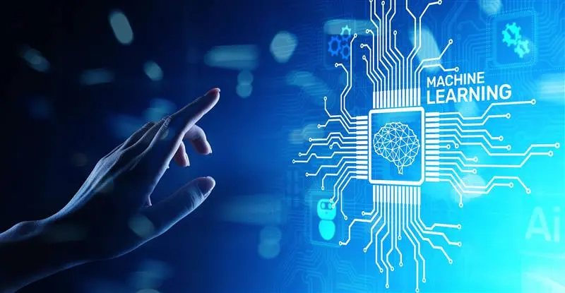 A close-up of a hand reaching toward a glowing digital graphic labeled “Machine Learning,” showing a microchip icon with a brain symbol and branching circuit lines on a blue background.
