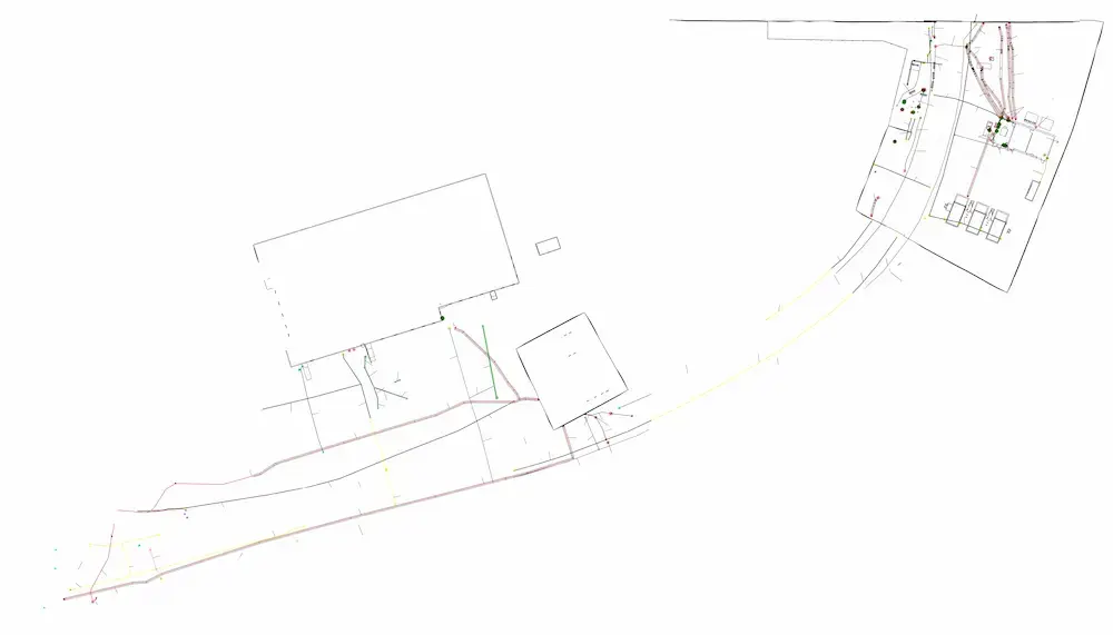 GPRS 2D CADD drawing showing building outlines and colored utility lines running along the access road.