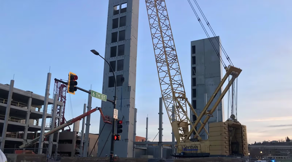 A leaning elevator shaft on a mixed use tower in Rapid City, South Dakota at sunset.