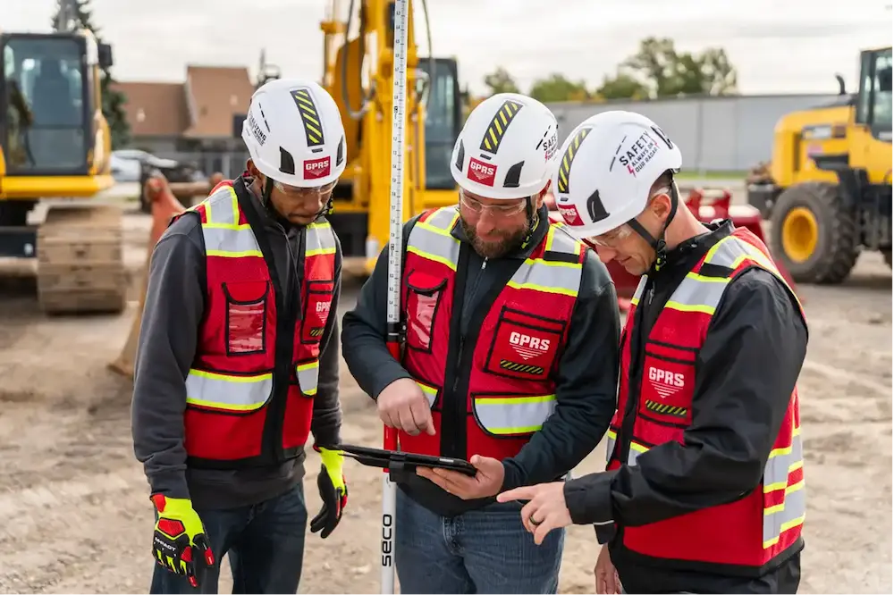 GPRS project managers look at an ipad on a project site, using ground-penetrating radar and SiteMap to document subsurface conditions and improve the safety of construction projects.