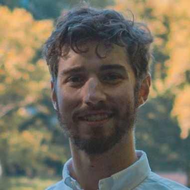 GPRS Modeling and CAD Technician Attilio Gentile III wearing a collared shirt in a park. 