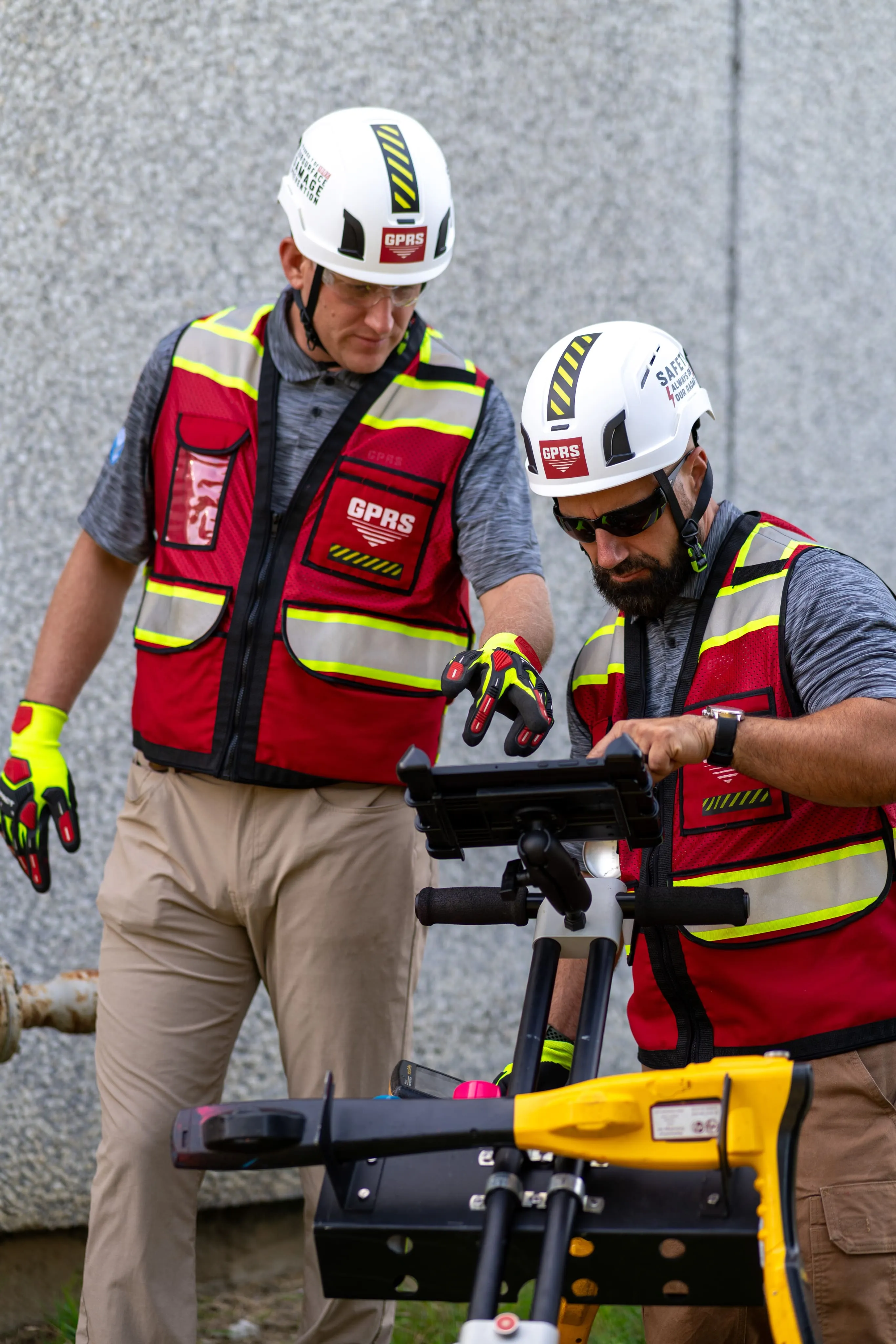Project managers using 3D laser scanning on a job site