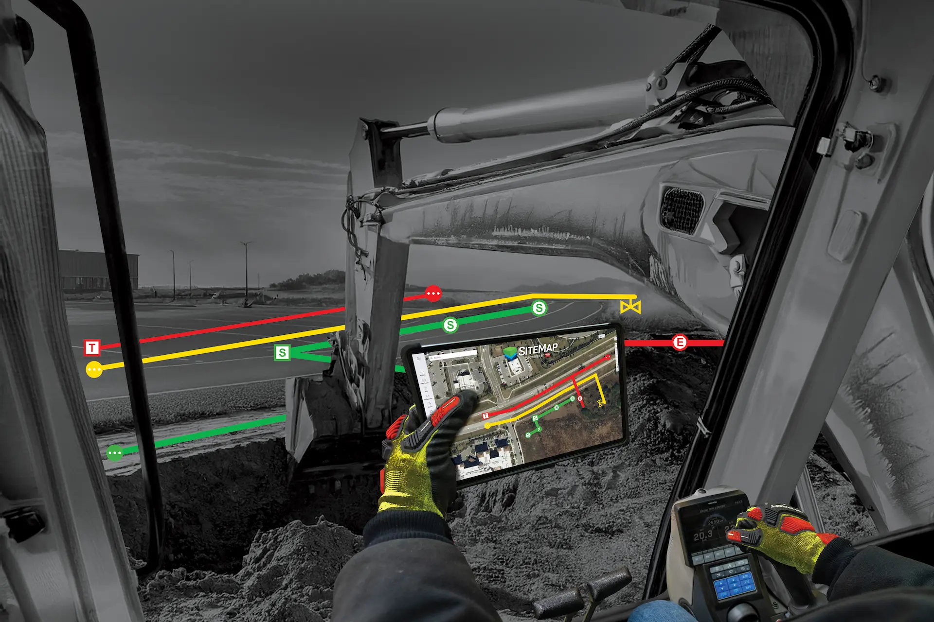 A construction worker holding a tablet with SiteMap data featured on it while at the controls of an excavator.