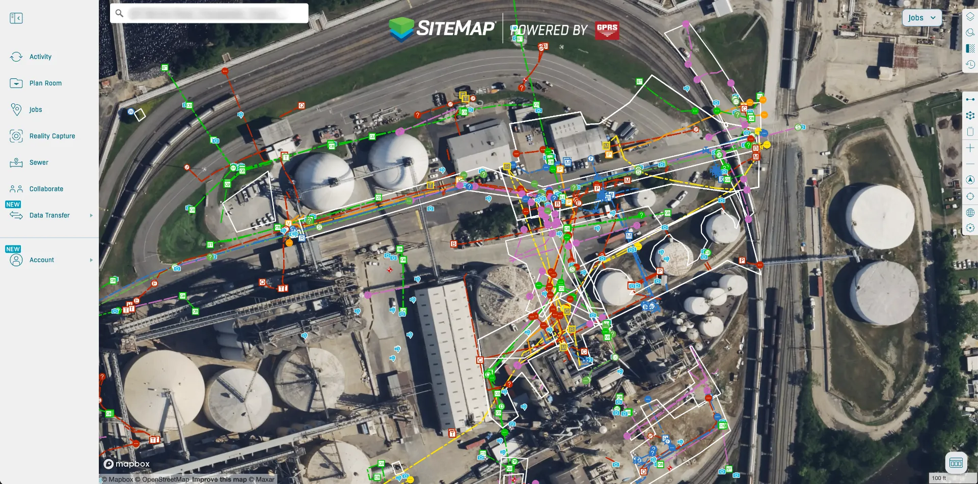Aerial view of an industrial complex with storage tanks, pipelines, and infrastructure overlaid with a colorful digital sitemap showing various icons and lines representing site data and connections.