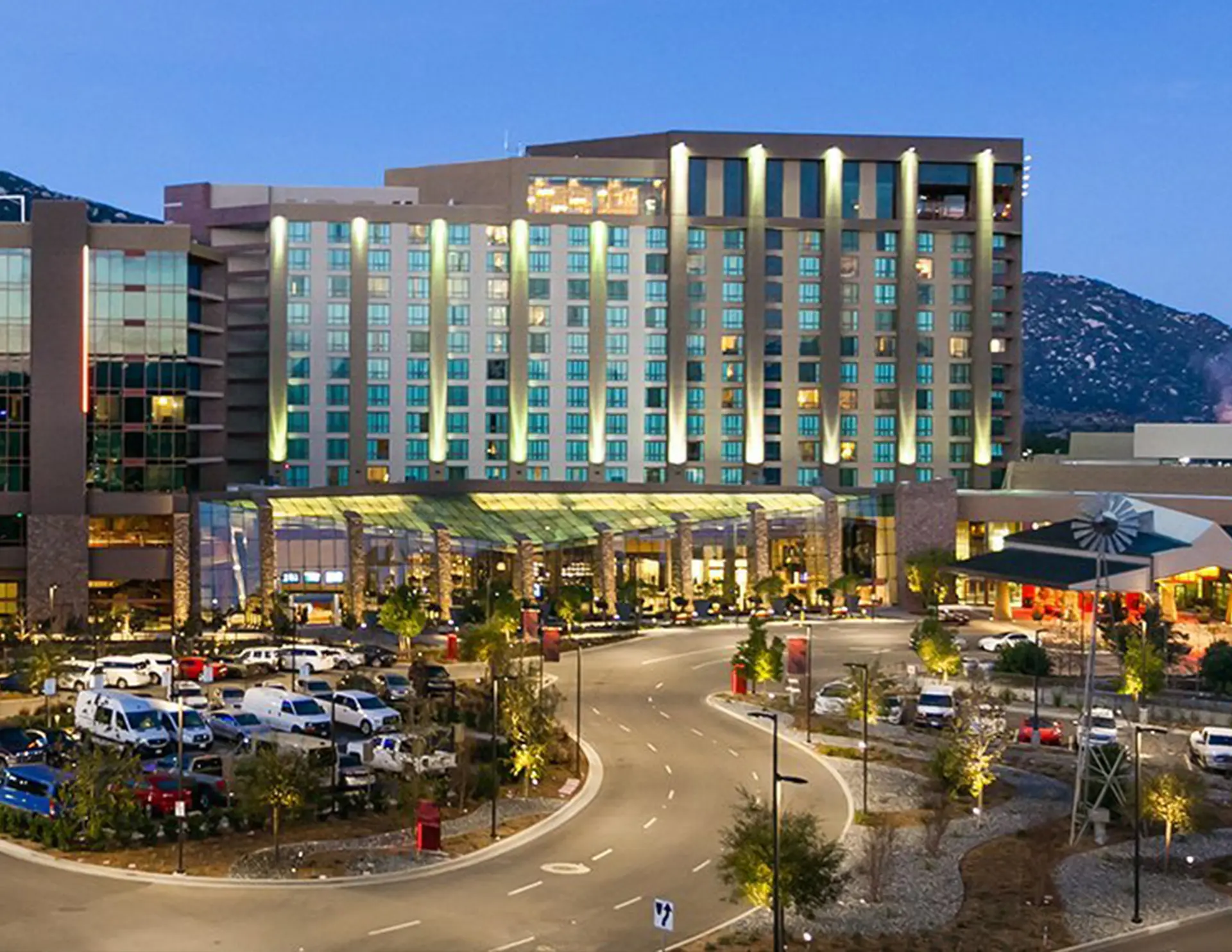 A tablet screen displaying a detailed aerial map of a campus‑style facility with multicolored utility lines, symbols, and pathways overlaid. A navigation sidebar on the left shows menu options such as Activity, Plan Room, Jobs, Reality Capture, and Data Transfer.