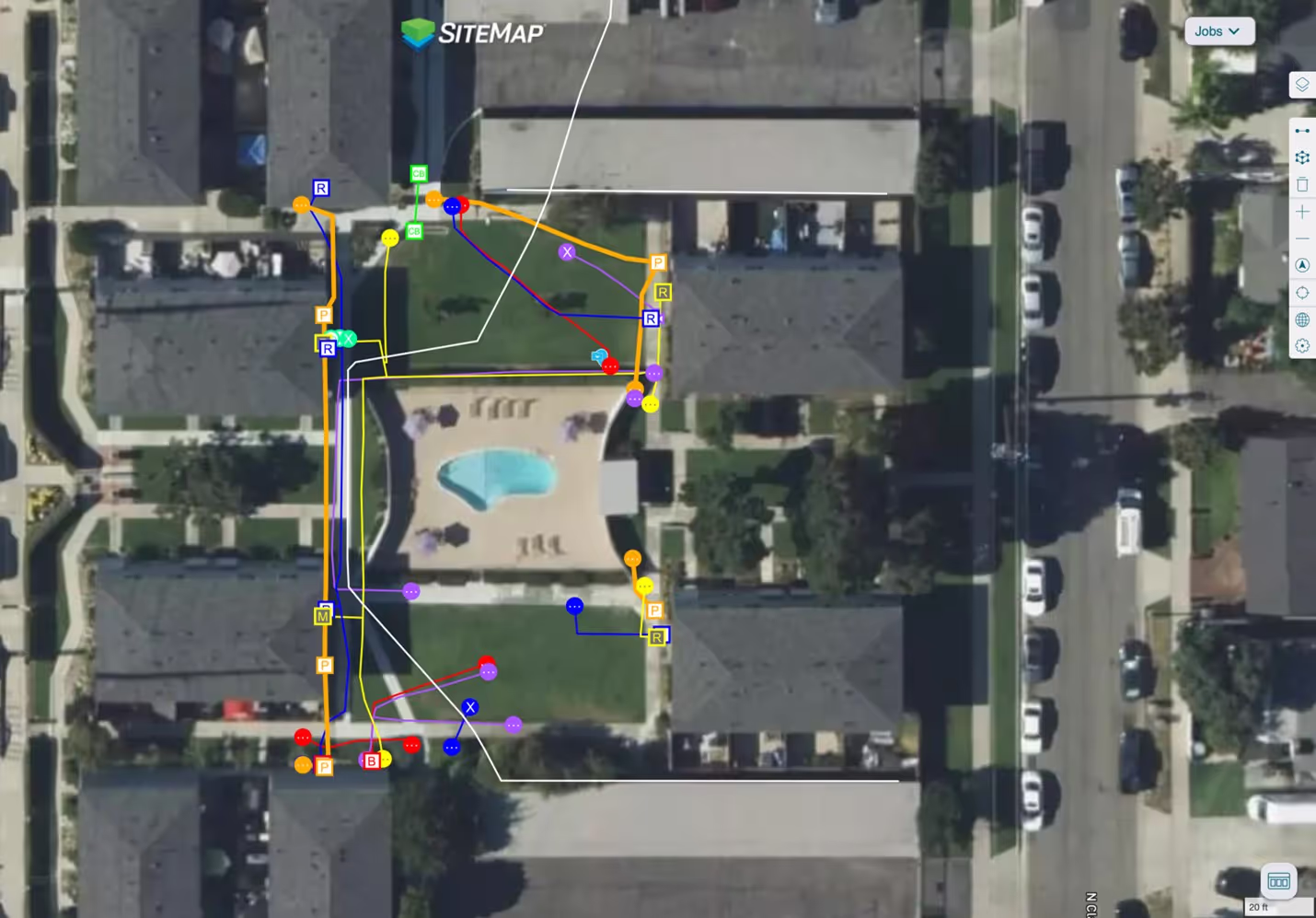 A neighborhood map displaying various colored lines representing utility data for an apartment complex on the SiteMap platform