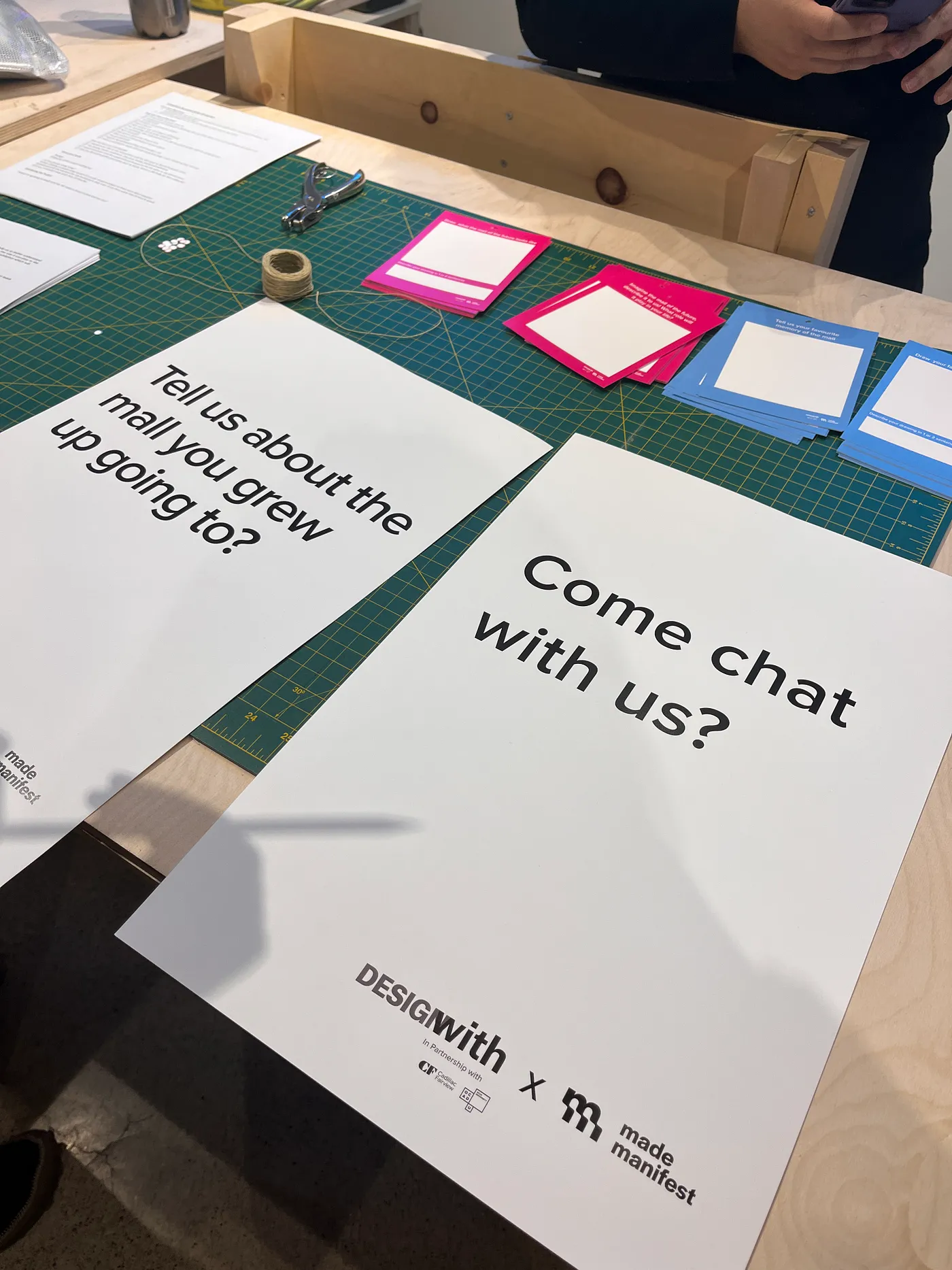 posters with prompts 'tell us about the mall you grew up going to' and 'come chat with us'.