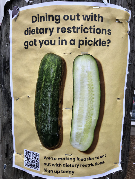 paper flyer posted on a wood pole reading