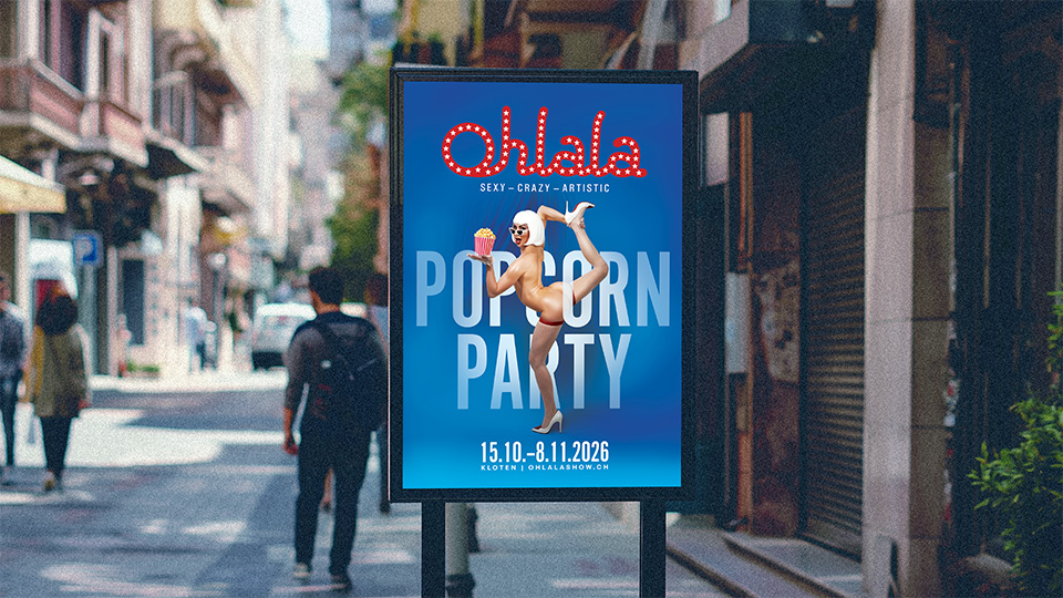 Ohlala Popcorn Party billboard mockup on a Swiss street — key art designed by KTB Media