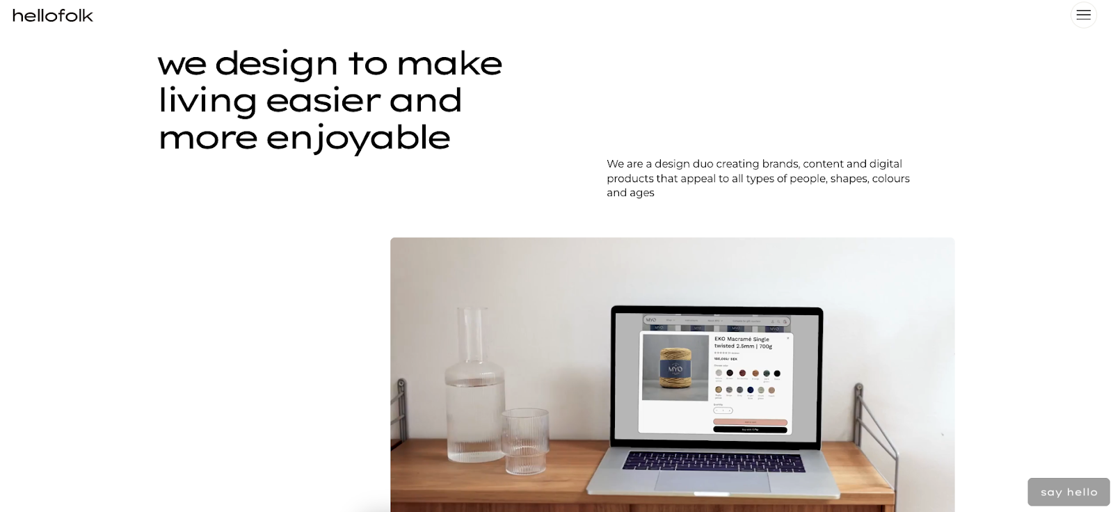 Hello Folk’s website has the text “we design to make living easier and more enjoyable” against a white background with a looping video.