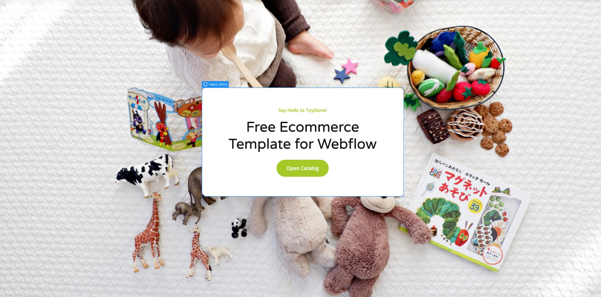 A hero intro div block on the ToyStore website. It reads: "Say Hello to ToyStore!" followed by "Free Ecommerce Template for Webflow." Below this text, there is a green call-to-action button that says "Open Catalog." The div block is surrounded by significant white padding.
