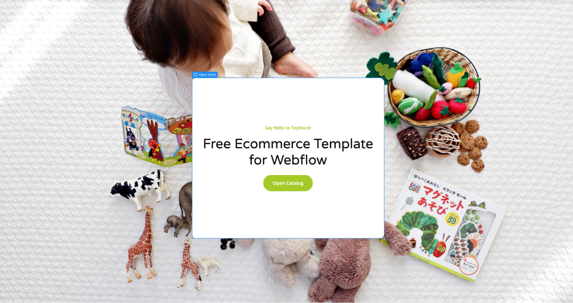 A hero intro div block on the ToyStore website. It reads: "Say Hello to ToyStore!" followed by "Free Ecommerce Template for Webflow." Below this text, there is a green call-to-action button that says "Open Catalog." The div block is square shaped and has move white padding above and below the text than on the sides.