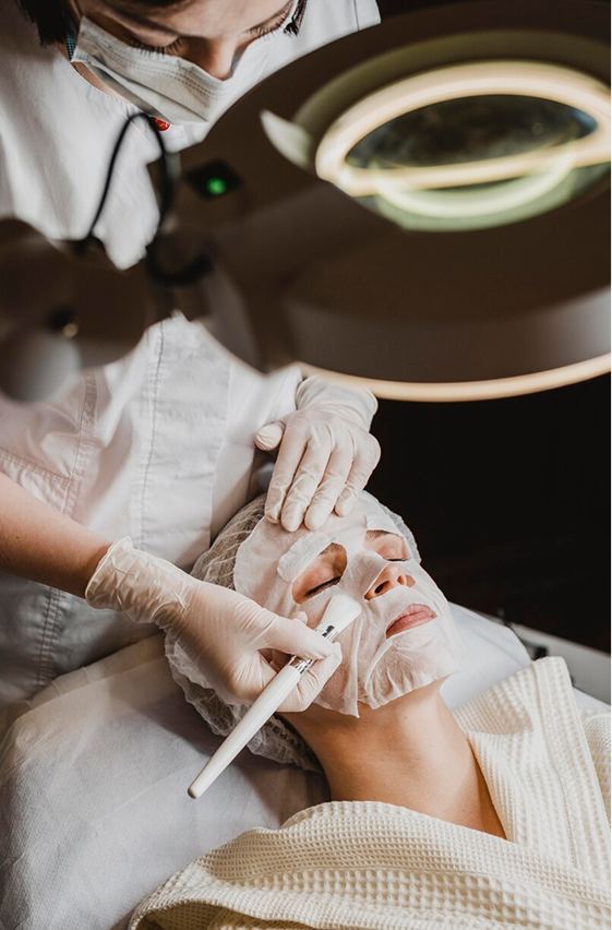 Healthcare professional holding a digital shield with a medical cross, representing secure, modern healthcare marketing services and digital solutions by Veewz.