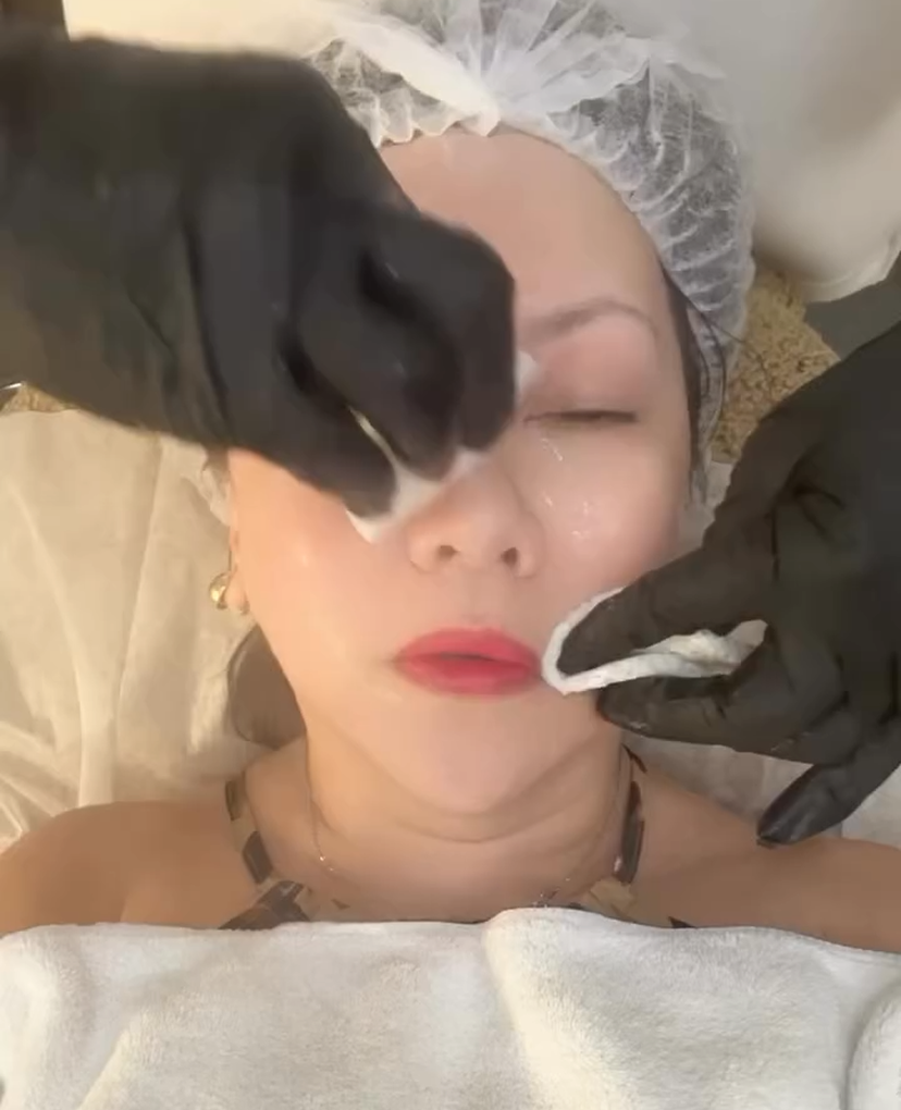 Healthcare professional holding a digital shield with a medical cross, representing secure, modern healthcare marketing services and digital solutions by Veewz.