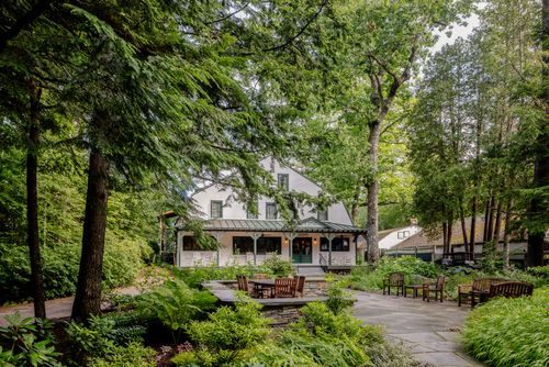 A lodge building surrounded by lush garden