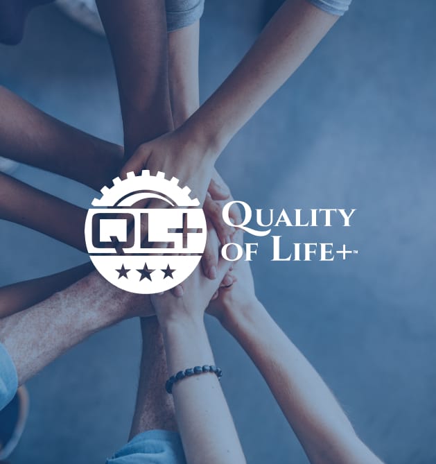 A photo of hands in for QL+