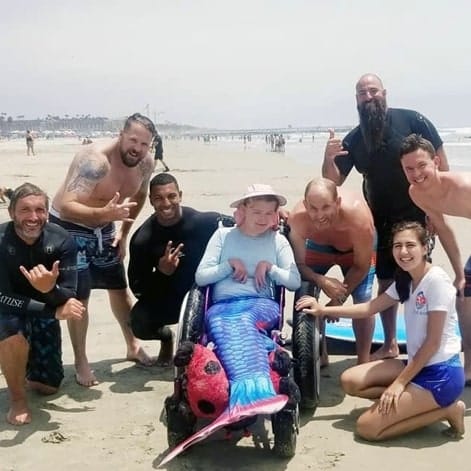 A group of SDSU students standing around a Challenger that they worked with