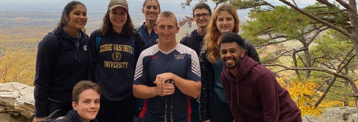 A group of students standing with their challenger