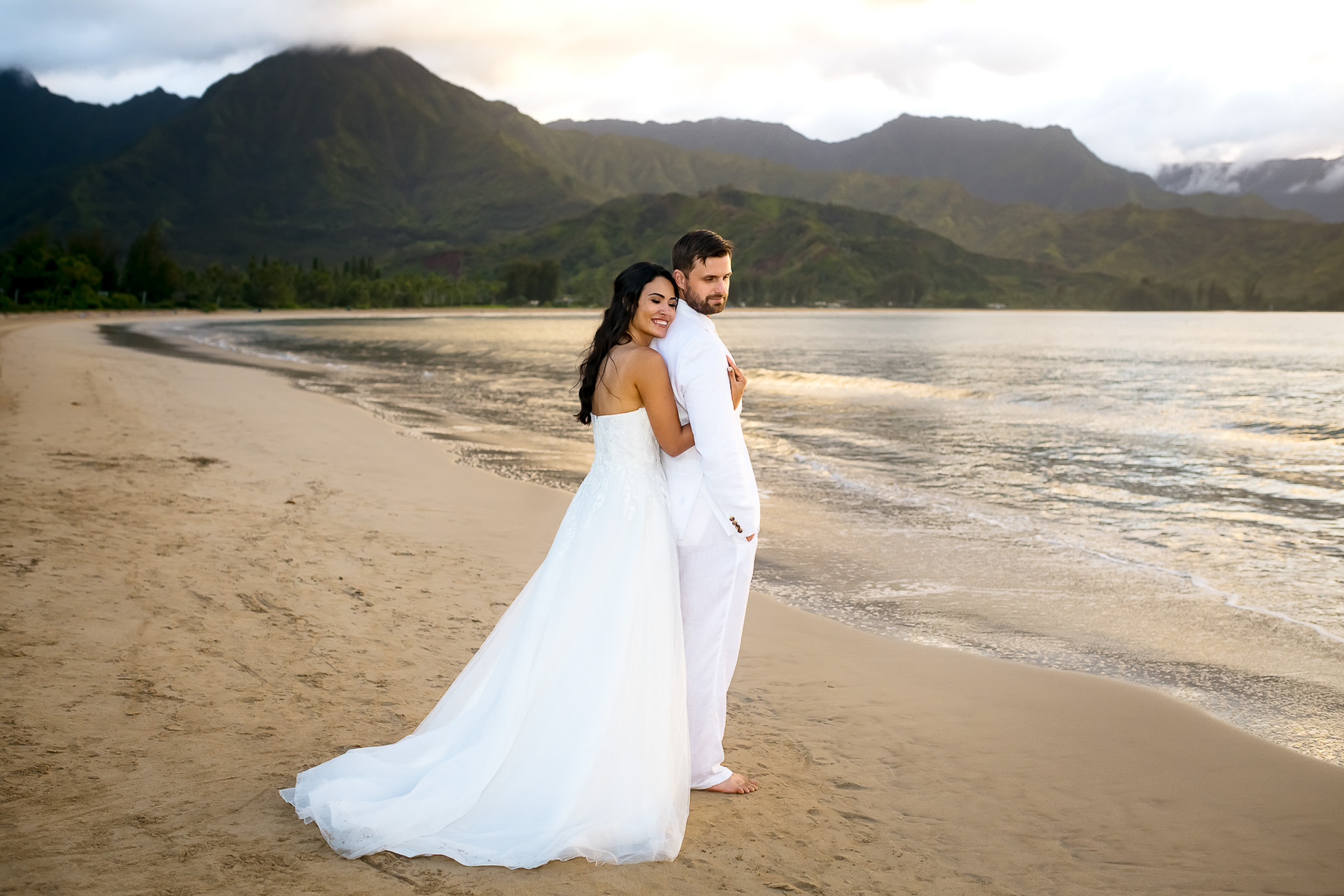Bride making her groom laugh during a Kauai elopement, photographed by a Kauai wedding photographer.
