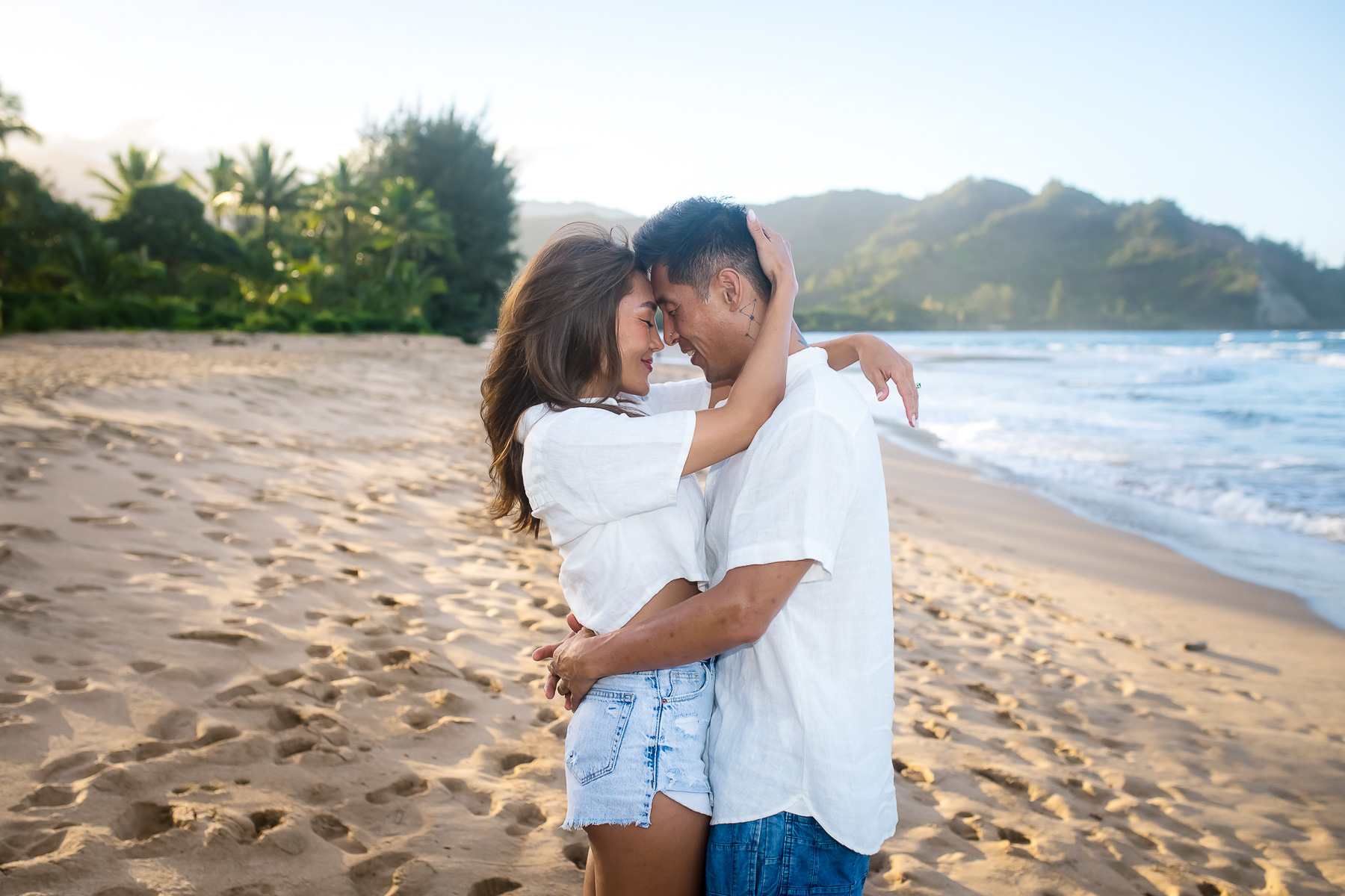Newly engaged couple share an embrace